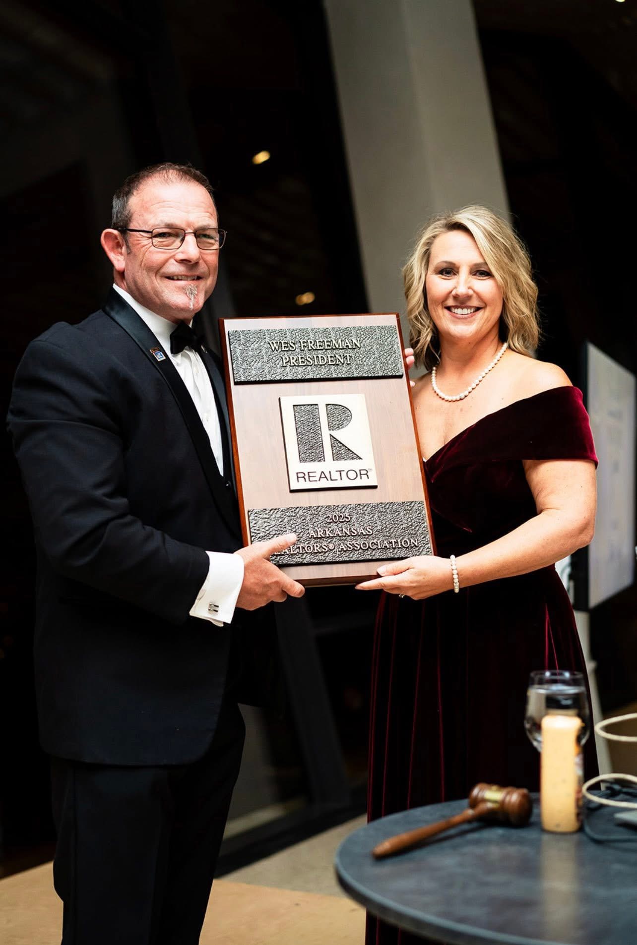 Wes Freeman accepting the 2025 Arkansas REALTORS Association President plaque